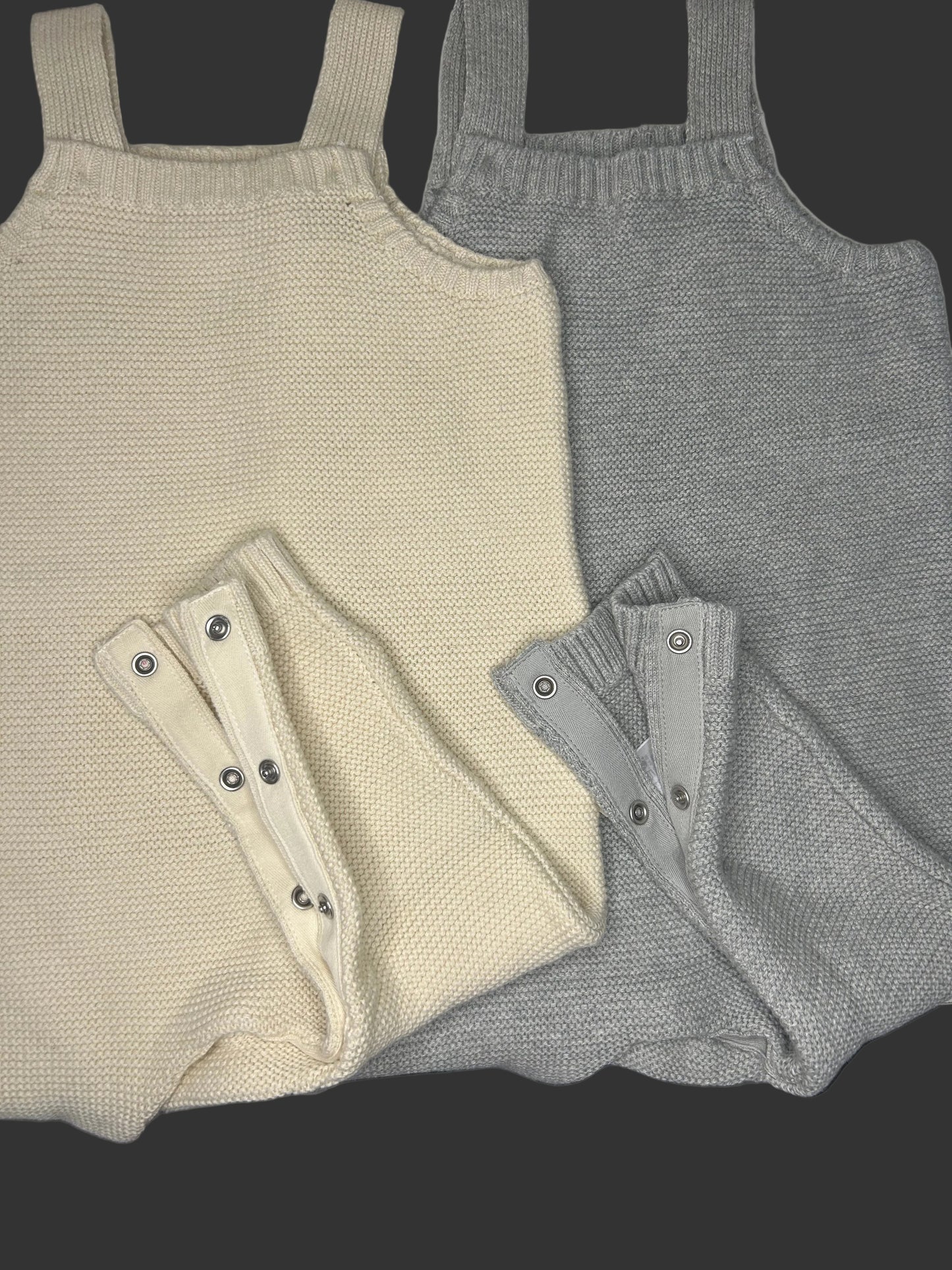 Knit overalls with button top and snaps up the full leg.